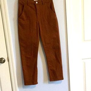 Brown high waisted loose-fit cotton jeans.